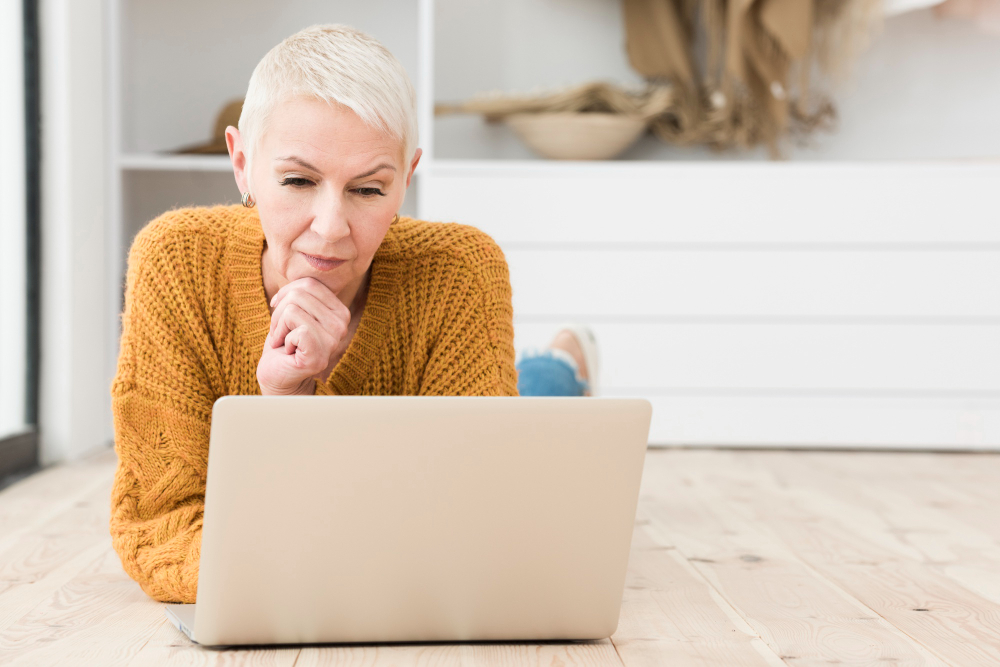 elderly-woman-thinking-laptop