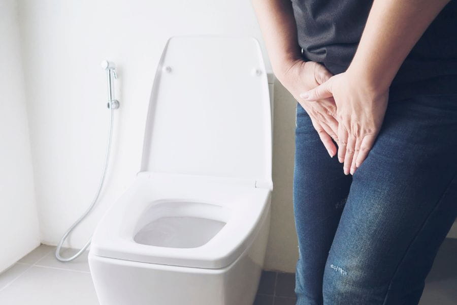 managing incontinence at work woman toilet