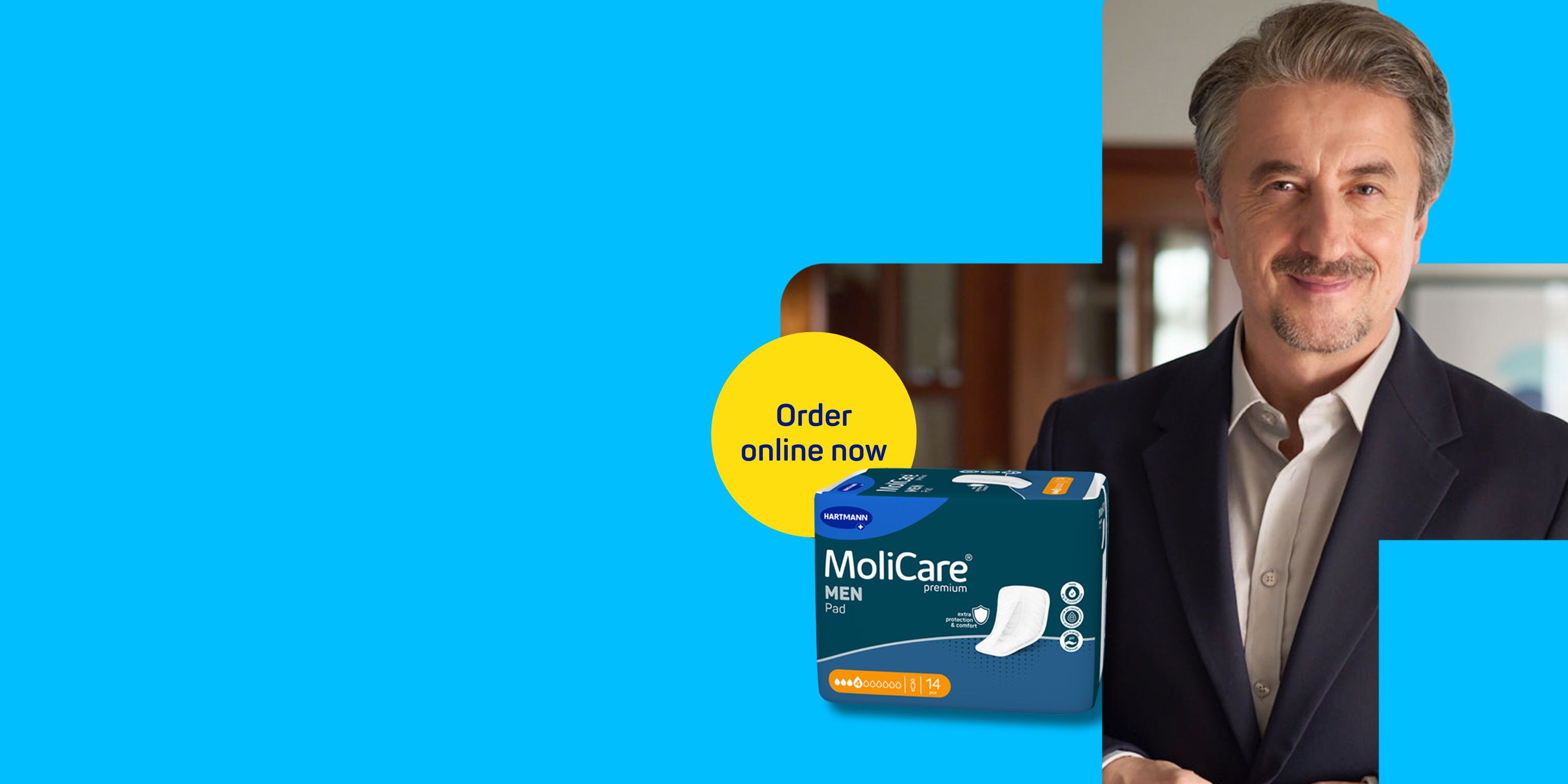 Older man with greying hair and a moustache in a dark blue suit and grey shirt