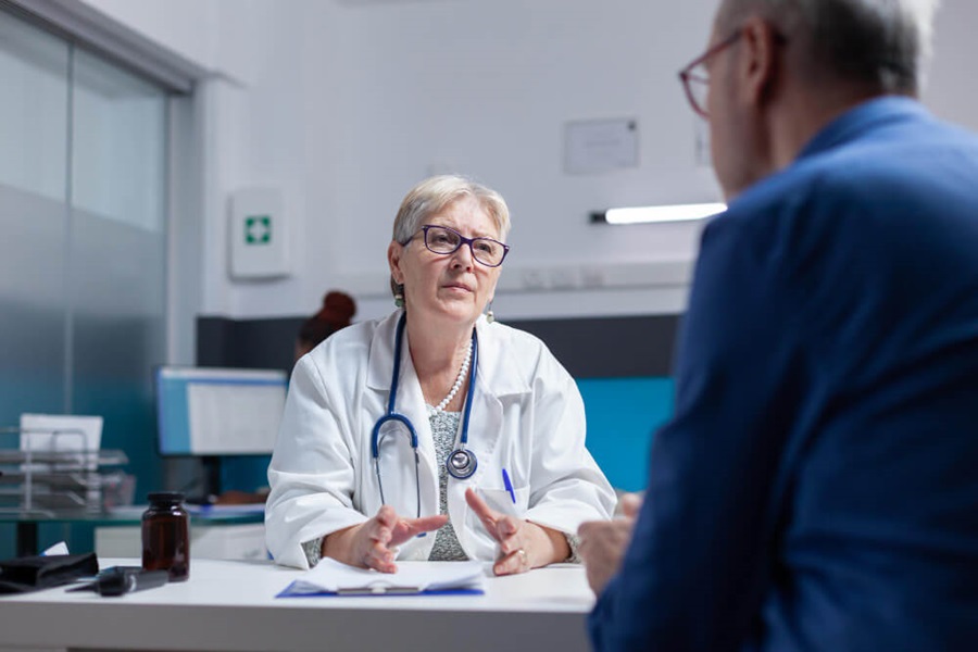 Man Consulting With Doctor